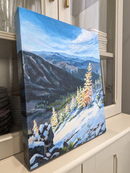 acrylic painting of yellow snowy larches against the cold mountain peaks.